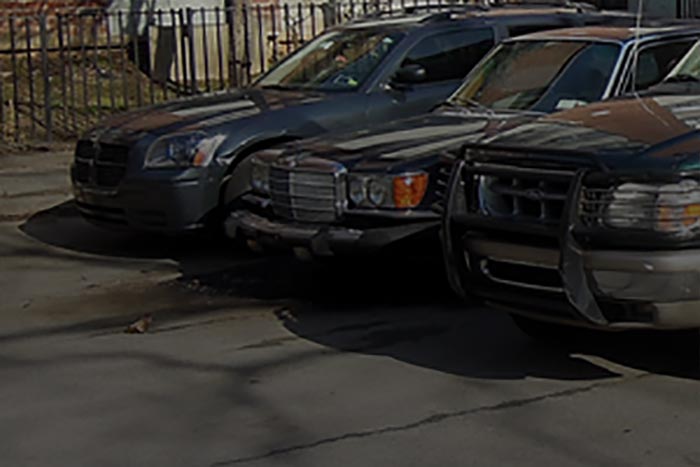 Three cars parked together